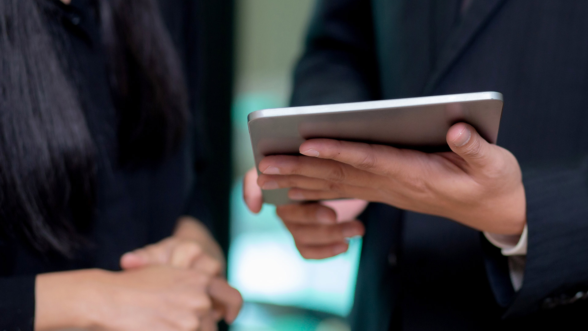 Man handling a tablet